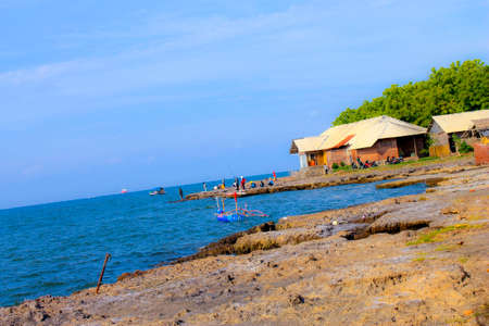 View of the tropical sea of ââIndonesia, there are coral, boats and anglersの写真素材