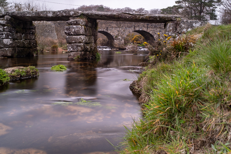 Two bridges on the River Dart with long exposure to smooth out the water