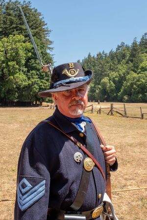 Duncan Mills, California, July, 15, 2018: A man playing the part of proud looking soldier of the...