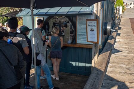 Victoria, Vancouver Island, British Columbia, Canada, July, 8, 2018: A number of people queuing for...