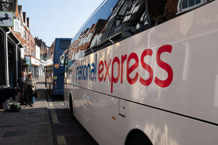 Marlborough, Wiltshire, England, March, 30, 2019: The National Express bus service pulls into the stop in Marlborough, UK to pick up and off load passengersのeditorial素材