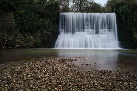 Trully Waterfall taken from the river with a slow shutter speed to give that smooth effect of the waterの写真素材