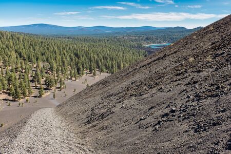 At the top of Cinder Cone, Lassen National Park looking back down the trial and across the forest, nobody in the pictureの写真素材