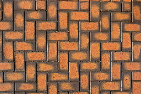 Outdoor orange patterned brick work ideal for a backgroundの写真素材