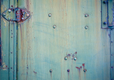 Background with Faded green chipped paint and hinge
