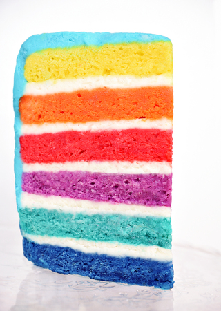 One piece multicolor six-layer cake on white backgroundの写真素材