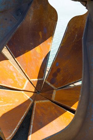 A close up of a rusty crane clawの写真素材