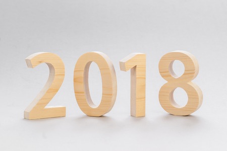 2018 Happy New Year, numbers cut fromlight  wood on a gray backgroundの写真素材