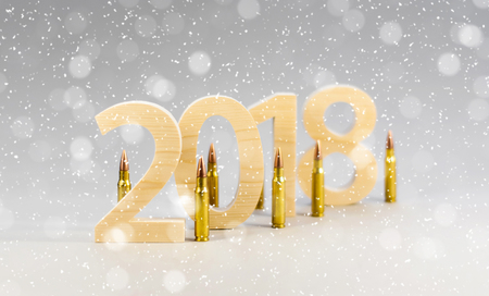 Figures 2018 are cut from solid wood with bullets for a rifle. New Year's concept of a military postcard. Ammunition, weapons, war, peace. Snowflakes backgroundの写真素材