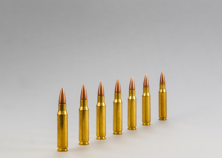 Rifle bullets. Brass Sleeve. On a white backgroundの写真素材