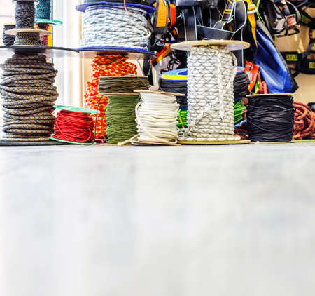 Cords for mountaineering in reels on the floor in a shop tourist equipment