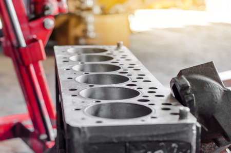 New polished carburetor in the car repair shop