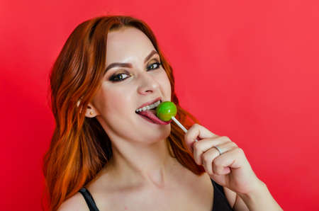 Beautiful naked woman posing on green background. Women's health, cosmetology, body careの写真素材