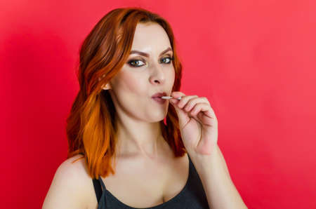 Beautiful naked woman posing on green background. Women's health, cosmetology, body careの写真素材