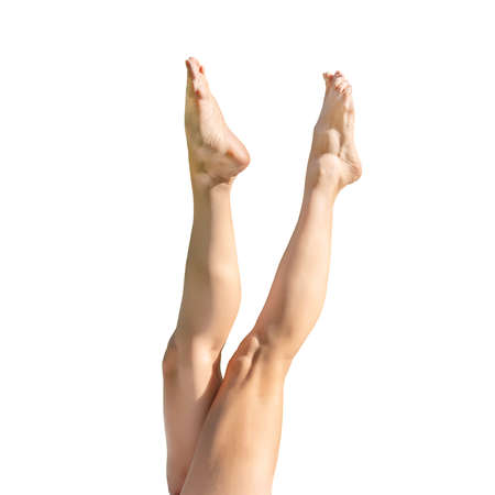 Beautiful, smooth female legs and feet. Isolated on white background with clipping path.