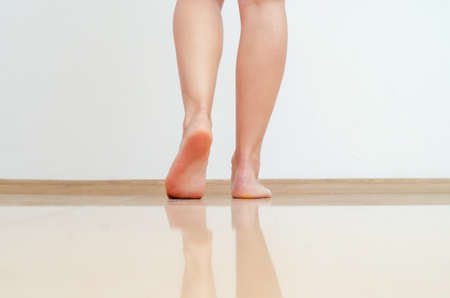 Woman shaves her legs with a razorの写真素材