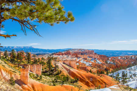 Red-yellow rocks in Bryce Canyon. Panorama of the mountain massif. A tourist place, a stone forest.の写真素材