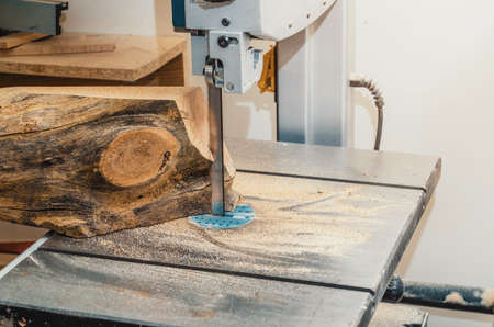 Band saw, the machine cuts the log on boards. Woodworking, wood products, work, employmentの写真素材
