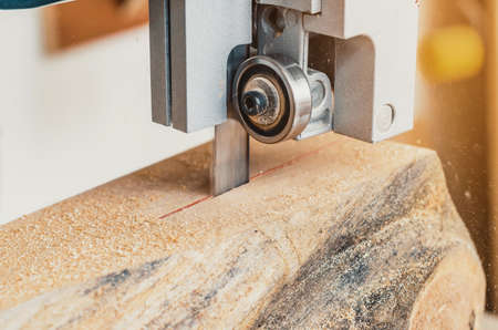 Band saw, the machine cuts the log on boards. Woodworking, wood products, work, employmentの写真素材