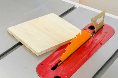square plate, tools, lying on a machine circular saw in a workshop woodworking.の写真素材