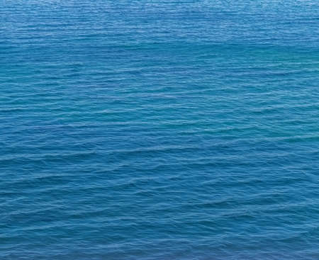 Small waves on the blue sea water. Nature background, travel vacation.の写真素材