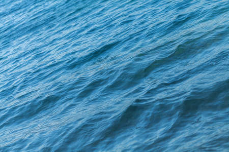 Small waves on the blue sea water. Nature background, travel vacation.の写真素材