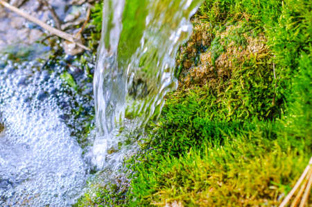 Beautiful screensaver with water background. Flow of clean fresh water. water delivery.の写真素材