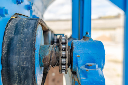 chain transmission. Chain on old equipment. Industrial background of worn chain deviceの写真素材