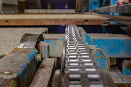 Roller chain rotates on old industrial machine. chain transmission. selective focusの写真素材