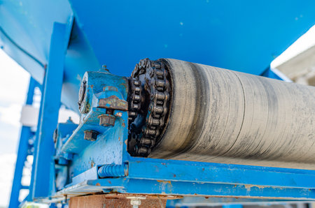Chain on old equipment. Industrial background of worn chain deviceの写真素材