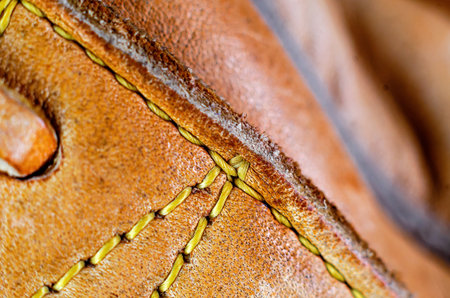 Close-up of stitching leather products with thick threadの写真素材
