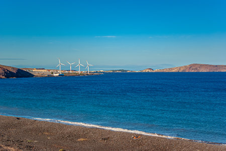 Four wind turbines on the coast of the Canary Islands, Spain. alternative energy.