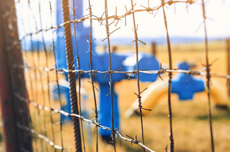 barbed wire stretched fenceの写真素材