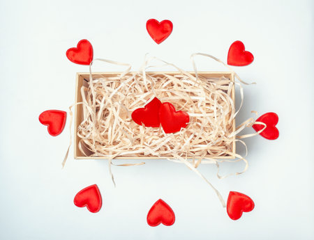 Ornament from many hearts. Cardboard box with red hearts. Valentine's Dayの写真素材