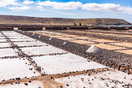Stone barriers on the seashore. Small stone construction. Mountains of the Canary Islandsの写真素材