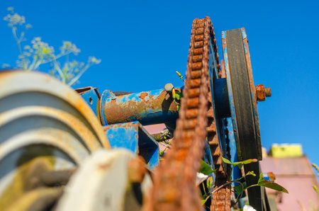 Rusty chain on gears of old mechanism, motor.の写真素材
