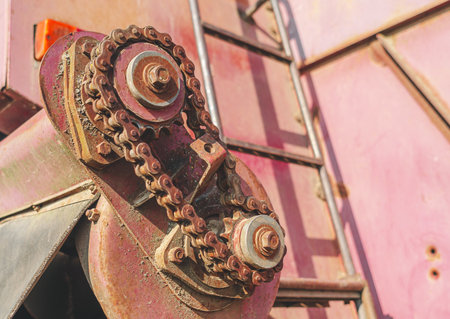 Rusty chain on gears of old mechanism, motor. red color