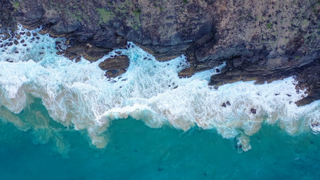 Incredible view rocks and sea. White wave foam crashes against the rocks. Nusa Penida, Indonesiaの写真素材