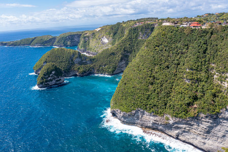 Incredible view rocks and sea. White wave foam crashes against rocks. Klungkung Bali Indonesiaの写真素材