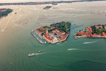 City island on water Venice, San Marco, Italy. Tiled roofs and ports. Historical buildings. Tourismの写真素材
