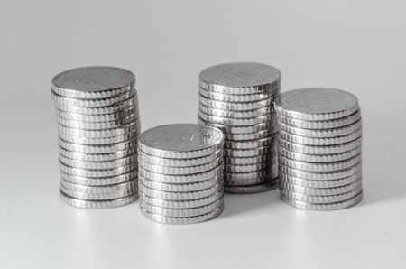 Close-up stack of 10 hryvnia coins, white background. Ukrainian coins. National currency. Macroの写真素材