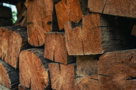 Chopped wooden beams are stacked to light the fireplace of stoveの写真素材