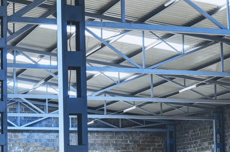 Metal trusses of the ceiling of an industrial shopの写真素材