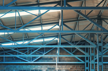 Metal trusses of the ceiling of an industrial shopの写真素材
