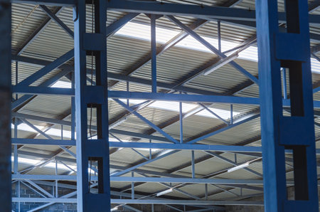 Metal trusses of the ceiling of an industrial shopの写真素材