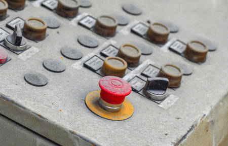 Big red button on old industrial equipment