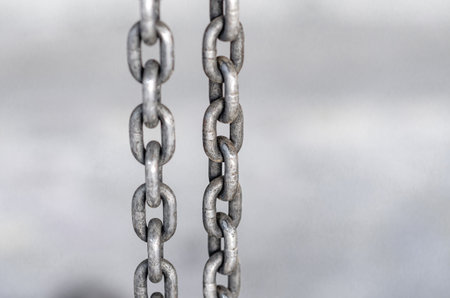 Metal chain on a gray backgroundの写真素材