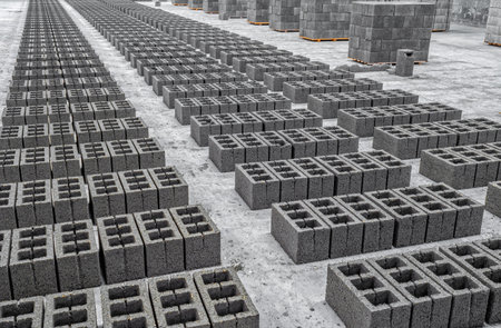 View of concrete cinder blocks, building material in form of gray bricks. Production at factoryの写真素材