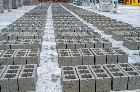 Rows of concrete cinder blocks, building material in form of gray bricks. Use on construction siteの写真素材