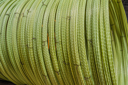 Macro photo of plastic wires twisted into rolls. Production of wire for fittings. Constructionの写真素材